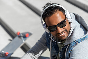 Image showing indian man in headphones listening to music