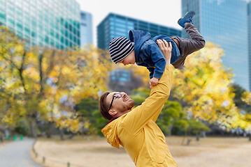 Image showing father with son having fun in autumn tokyo city