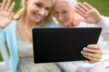 Image showing daughter with tablet pc and senior mother at park