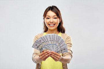 Image showing asian woman with hundreds of dollar money