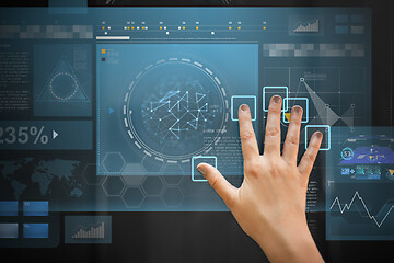 Image showing hand using black interactive panel with charts