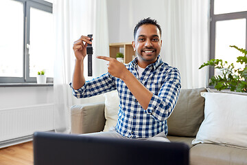 Image showing male blogger recording video review of smart watch