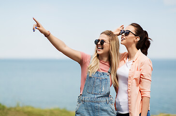 Image showing teenage girls or best friends at seaside in summer