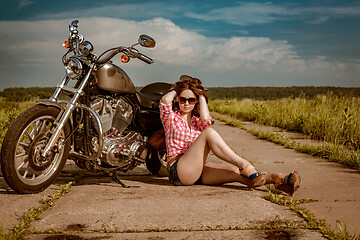 Image showing Biker girl and motorcycle