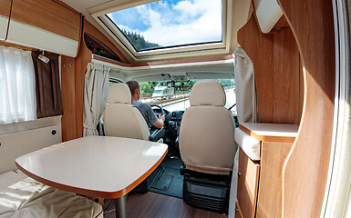 Image showing Man driving on a road in the Camper Van RV