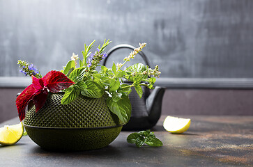 Image showing teapot and herb