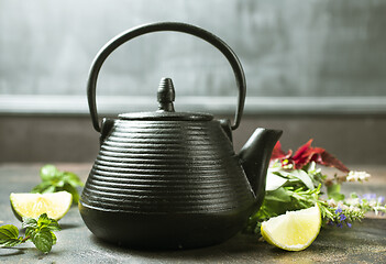 Image showing teapot and herb