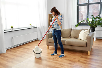 Image showing woman or housewife with mop cleaning floor at home