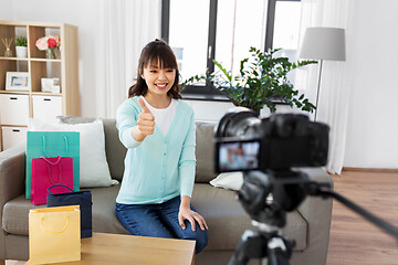 Image showing female blogger making video blog about shopping