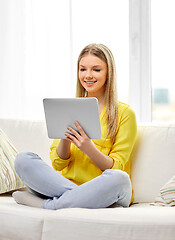 Image showing young woman or teenage girl with tablet pc at home