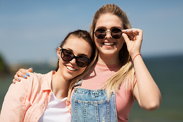 Image showing teenage girls or best friends at seaside in summer