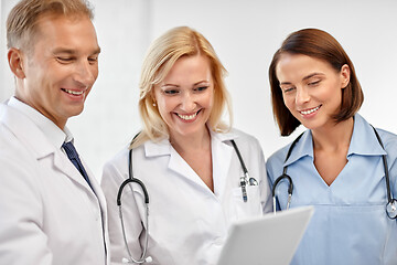 Image showing group of doctors with tablet computer at hospital