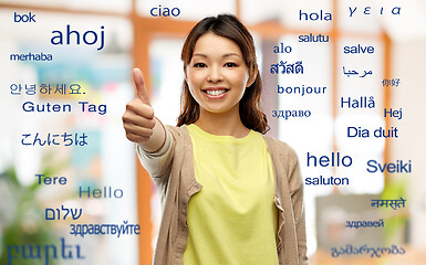 Image showing happy asian woman showing thumbs up