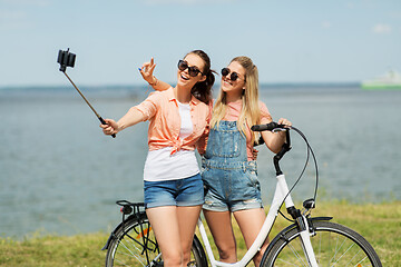 Image showing teenage girls with bicycle taking selfie in summer