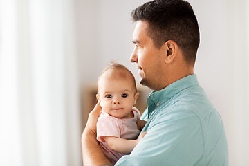 Image showing middle aged father with baby daughter at home