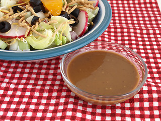 Image showing Salad and Dressing on Red Checks