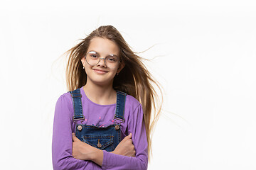 Image showing Portrait of a cheerful authentic girl with developing hair