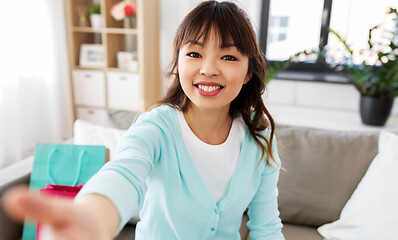 Image showing asian female blogger taking video or selfie