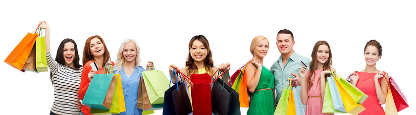 Image showing asian woman with shopping bags and people
