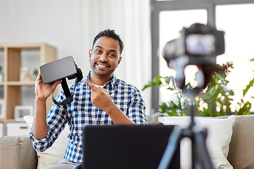 Image showing male blogger with vr glasses videoblogging at home