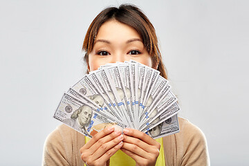 Image showing asian woman with hundreds of dollar money