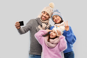 Image showing happy family taking selfie by smartphone