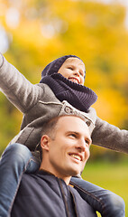 Image showing happy family having fun in autumn park