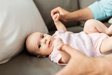 Image showing middle aged father playing with baby at home