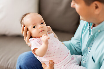 Image showing middle aged father with baby daughter at home