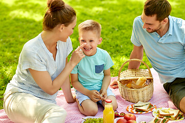 Image showing happy family having picnic at summer park