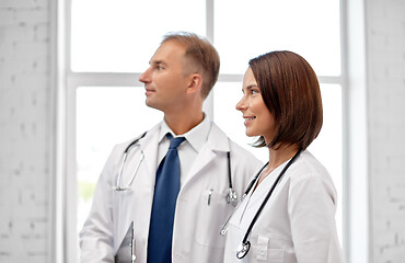 Image showing smiling doctors in white coats at hospital