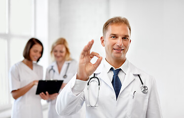 Image showing smiling doctor at hospital showing ok sign