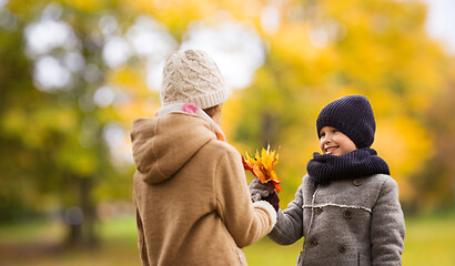 Image showing smiling children in autumn park