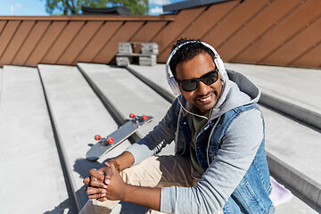 Image showing indian man in headphones listening to music