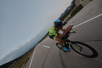 Image showing triathlon athlete riding bike