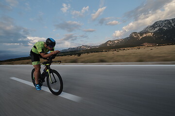 Image showing triathlon athlete riding bike