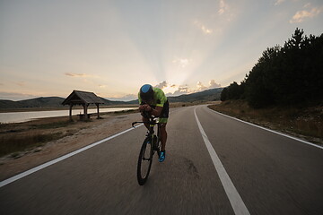 Image showing triathlon athlete riding bike