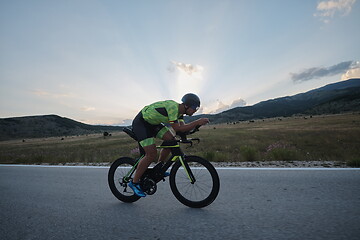 Image showing triathlon athlete riding bike