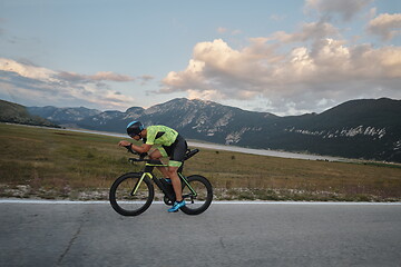 Image showing triathlon athlete riding bike