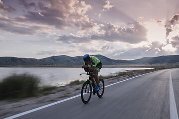 Image showing triathlon athlete riding bike