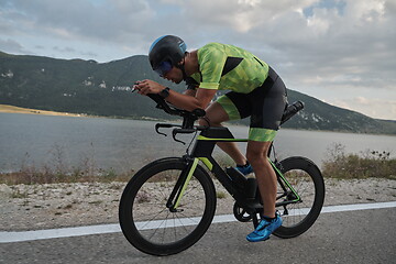 Image showing triathlon athlete riding bike