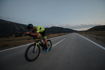 Image showing triathlon athlete riding bike