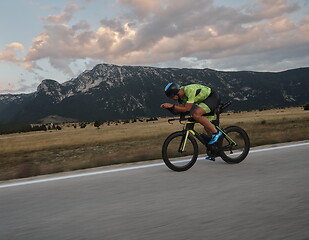 Image showing triathlon athlete riding bike