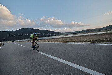 Image showing triathlon athlete riding bike