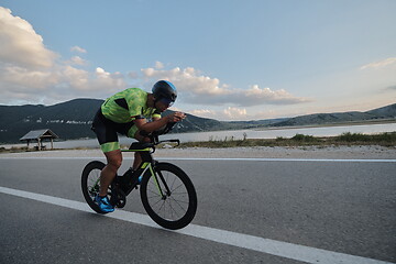 Image showing triathlon athlete riding bike