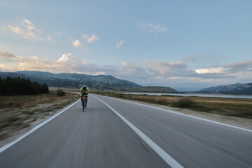 Image showing triathlon athlete riding bike