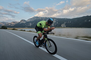 Image showing triathlon athlete riding bike