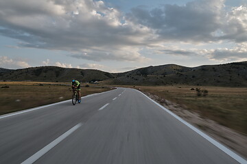 Image showing triathlon athlete riding bike