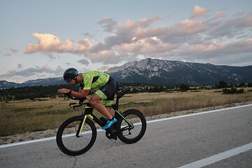 Image showing triathlon athlete riding bike