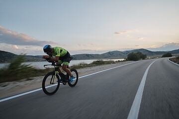 Image showing triathlon athlete riding bike